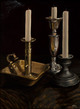 Three candleholders with candles